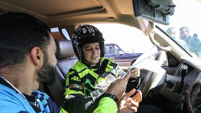 A female Tunisian driver during the Hamada al-Hamra auto rally held in an area about 180 kilometres south-west of Libya's capital, Tripoli. All photos: AFP