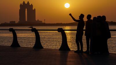 Sunset on the Corniche at Abu Dhabi. The UAE plans to strengthen its response to heat stress. Victor Besa / The National