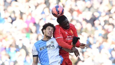 Blackburn’s Rudy Gestede, left, vies with Kolo Toure of Liverpool during their first FA Cup quarter-final match. Paul Ellis / AFP