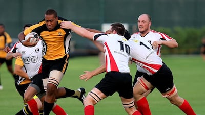 Al Ain Amblers, in yellow, will be looking to run past the Jebel Ali Dragons in their UAE Conference final today. Satish Kumar / The National