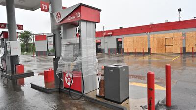 A gas station and nearby businesses are boarded up ahead of the imminent impact in St Catherine, Jamaica. EPA