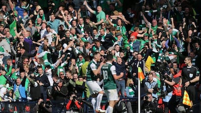 Anthony Stokes celebrates with John McGinn after scoring the second goal for Hibernian. Reuters / Russell Cheyne