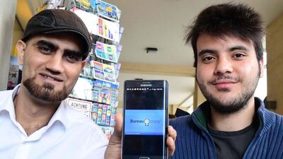Omar Alshafai (L) and Ghaith Zamrik pose for a picture in Berlin's Mitte district on August 11, 2016. Tobias Schwarz/AFP
