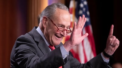 A giddy Senate Majority Leader Chuck Schumer celebrates Senator Raphael Warnock's victory, giving Democrats a 51-seat majority. EPA