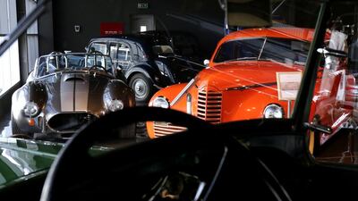 A Shelby Cobra, left, alongside a 1946 Packard Clipper. Victor Besa for The National