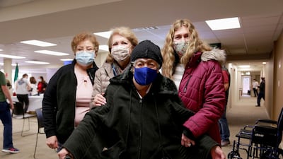 Aura Rojas De Castaneda, 98, with her daughter Edna Dambruuoso and grand daughter Michelle Dambruoso, after getting her coronavirus disease vaccination at an event organised by the Mexican consulate and local health officials in Atlanta, Georgia, US. Reuters