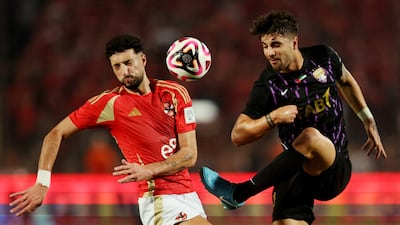 Al Ain's Fabio Cardoso in action with Al Ahly's Wessam Ali. Reuters