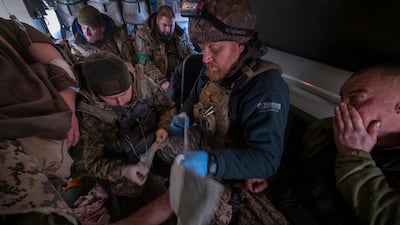 A Ukrainian soldier is taken to a field hospital. EPA