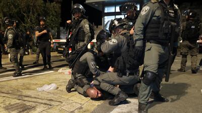 Israeli police officers detain a Palestinian demonstrator during clashes. Tensions have been running high over the possible eviction of Palestinian families near the Damascus Gate. AP Photo