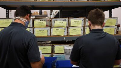 Poll workers sort ballots at the Franklin County Board of Elections in Columbus, Ohio. Reuters