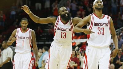 James Harden, centre, and Corey Brewer, right, celebrate during the Houston Rockets' win over Portland. Scott Halleran / Getty Images