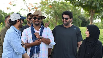 Sujeeth Reddy with Prabhas, the film's producer and H.E. Maryam Eid Al Mheiri. Supplied