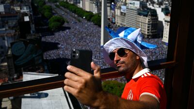 An Argentina fan takes a selfie in Buenos Aires. AFP
