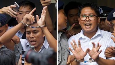 Myanmar journalists Kyaw Soe Oo, left, and Wa Lone are escorted from the court in Yangon on September 3, 2018. AP Photo