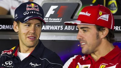 Fernando Alonso, right, was found by a report to be Formula One's most marketable driver while Sebastian Vettel, left, winner of the last four championships, was deemed the sport's fourth most marketable figure. Christopher Pike / The National