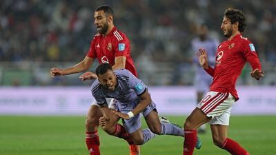 Madrid's Brazilian forward Rodrygo after a challenge by Ahly's Amr el-Solia and Mohamed Hany. AFP