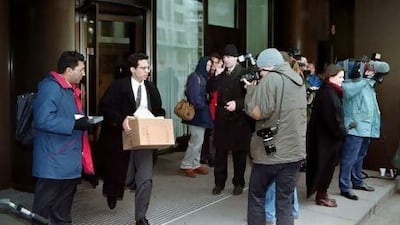 A financial district worker hurries away from the offices of the Barings Brothers Bank, Britain's oldest merchant bank that was put into administration in 1995 after reporting losses of more than US$850 million.