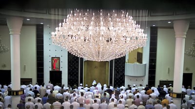 Men pray at a mosque in the Khalidiya neighborhood in Abu Dhabi. August 2, 2011. Silvia Razgova / The National