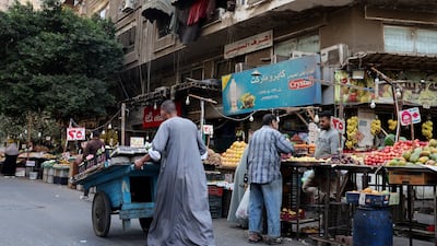 Fruit sellers at a market in Cairo. Egypt has largely contained the economic fallout from the regional conflict. Reuters