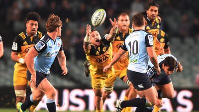 TJ Perenara of Wellington Hurricanes lunges for the ball during last week's Super Rugby match against NSW Waratahs. Dean Lewins / EPA / July 9, 2016