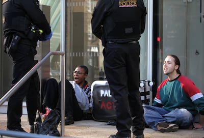 Palestine Action campaigners outside the Scotiabank building in central London. PA