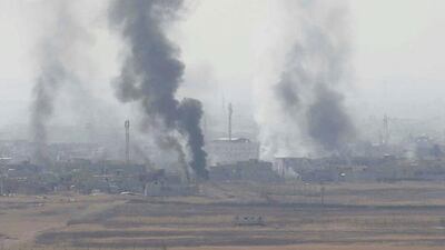 Smoke rises from clashes at Bartila in the east of Mosul during clashes with ISIL militants in Iraq on October 18, 2016. Thaier Al Sudani/Reuters