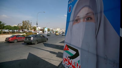 Campaign posters of candidates for the upcoming Jordanian parliamentary elections line a street in the capital Amman. AFP