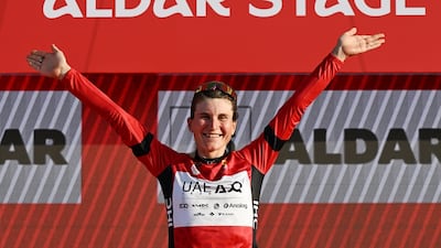Elisa Longo Borghini of UAE Team ADQ celebrates on the podium after taking the overall lead in the UAE Tour Women. UAE Tour
