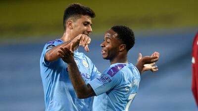 Manchester City's Raheem Sterling is congratulated by teammate Rodrigo. AP