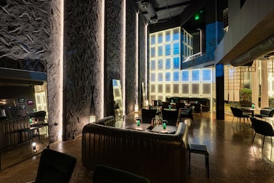 The dimly lit space feels like an exclusive members' club. Photo: Bocasu