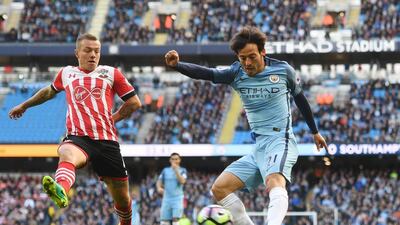 Jordy Clasie of Southampton attempts to block a cross from David Silva of Manchester City. Michael Regan / Getty Images