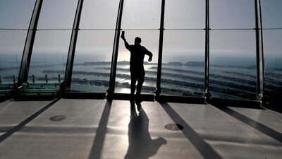 A man takes a selfie on the observation deck of The View at The Palm, Dubai. AP Photo