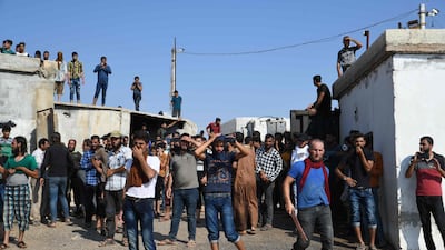 Displaced Syrians demonstrate along the border with Turkey in Idlib province on August 30, 2019 demanding Ankara help stop a deadly Damascus offensive. AFP