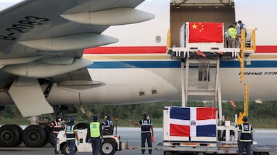Airport operators unload a batch of Sinovac Covid-19 vaccine at the Santo Domingo International Airport, Dominican Republic. EPA