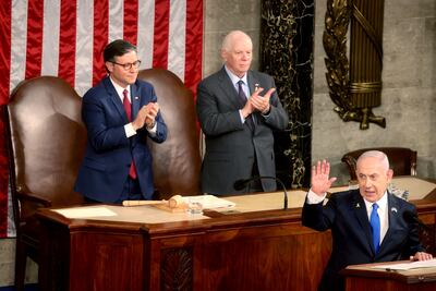 US Senator Ben Cardin, centre, applauds during an address by Benjamin Netanyahu, right, to Congress last month. Bloomberg
