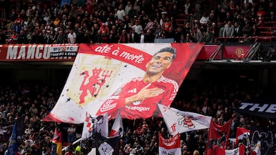 Manchester United fans hold up a Casemiro banner ahead of the Brazilian midfielder playing his final home game for club. PA