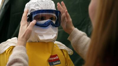 Deborah Williams wonders if she should prepare herself like an Ebola health worker as she deals with feelings of a looming crisis. Photo: Salvatore Di Nolfi / EPA