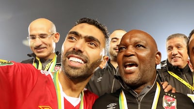 Al Ahly manager Pitso Mosimane, right, alongside Hussein El Shahat after their victory over Zamalek in the Caf Champions League final at the Cairo International Stadium, on November 27, 2020. EPA