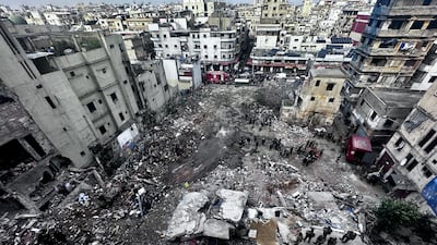 Rescuers work at the site of the collapsed residential building in Tripoli, Lebanon. According to Lebanon's civil defence, 14 people died and eight people were rescued from the rubble of the collapsed building. EPA