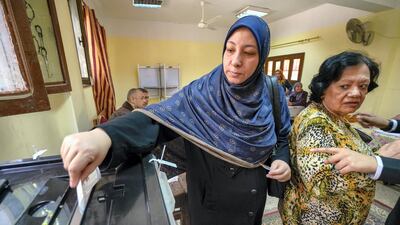 A woman casts her vote at a polling station in Shubra. Dana Smillie for The National