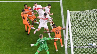 Turkey's Samet Akaydin heads home to put his side in front. AFP