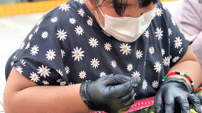 The metallic-coloured face accessory was worn by women in the early days of the UAE to show they were married or as a form of protection from the sun and dust. The National