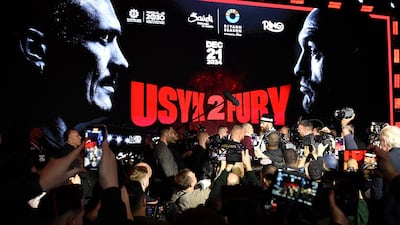 Britain's Tyson Fury and Ukraine's Oleksandr Usyk face off. AFP