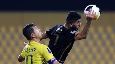 Al Sadd's Mohammed Waad handles the ball in the AFC Champions League Elite match against Al Wasl.