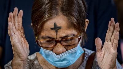 A Catholic woman at prayer on Ash Wednesday. Getty Images