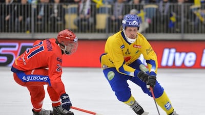 Russia's Igor Larionov, left, and Sweden's Daniel Mossberg in action during the Bandy World Championship final in Vanersborg, Sweden in February 2013. Anders Wiklund / AP