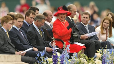 Queen Elizabeth watches a parade with her family during celebrations for the Queen's Golden Jubilee in 2002. Getty Images