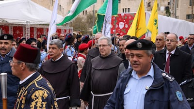 Custodian of the Holy Land Father Francesco Patton, centre, arrives for the ceremony. AFP