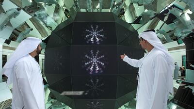 Visitors view an installation at Al Burda Festival in 2018, an event set up to complement the Al Burda Award, at Warehouse 421, Abu Dhabi. Leslie Pableo for The National