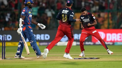 Royal Challengers Bangalore's Mohammed Siraj, right, after taking the wicket of Lucknow Super Giants' Kyle Mayers. AP